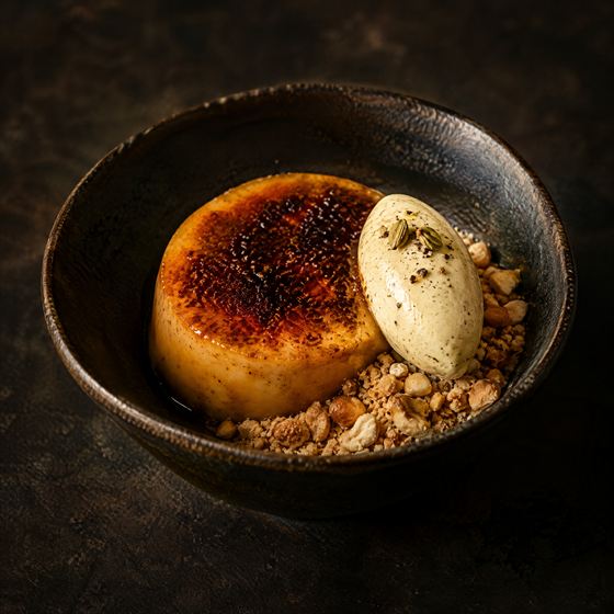 Smoked jaggery custard with cardamom cream and cashew crumble