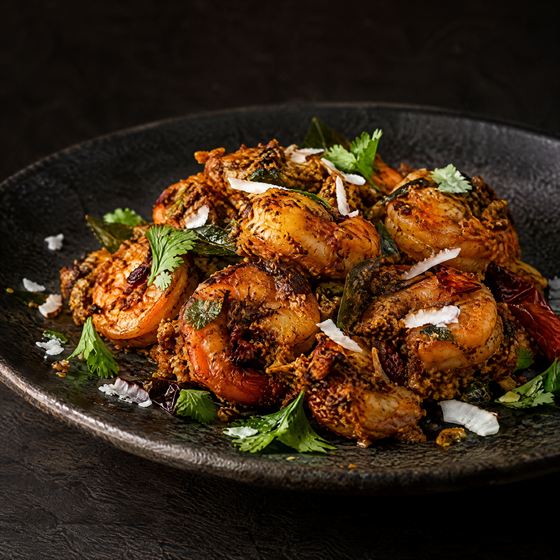 Prawns tossed in dry roasted coconut masala